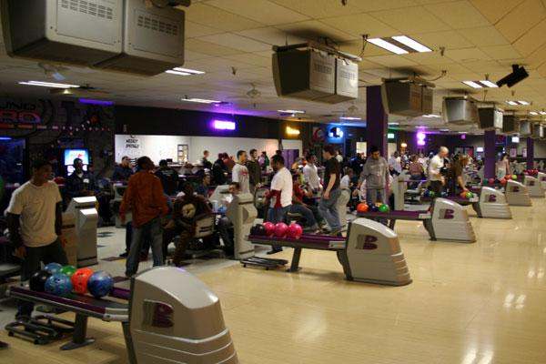 a group of people in a bowling alley