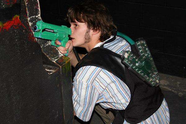 a man playing with a toy gun