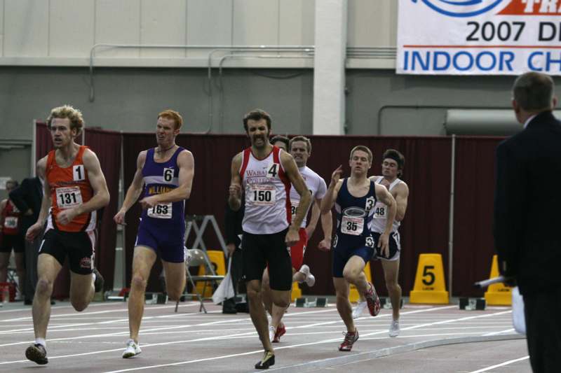 a group of men running on a track