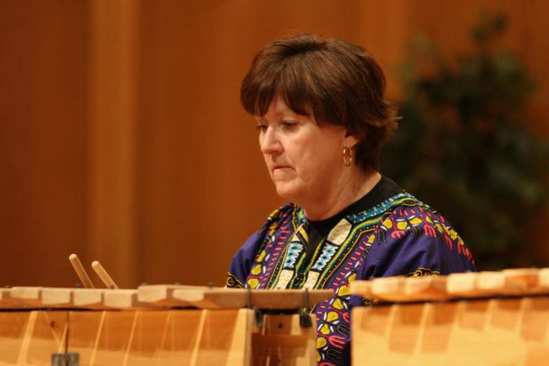 a woman playing a xylophone
