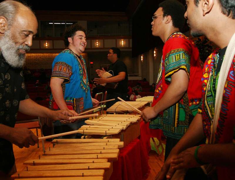 a group of men playing xylophones