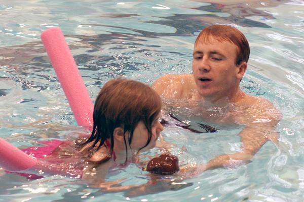 a man and a woman in a pool