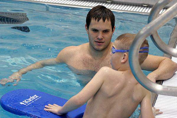 a man and boy in a pool