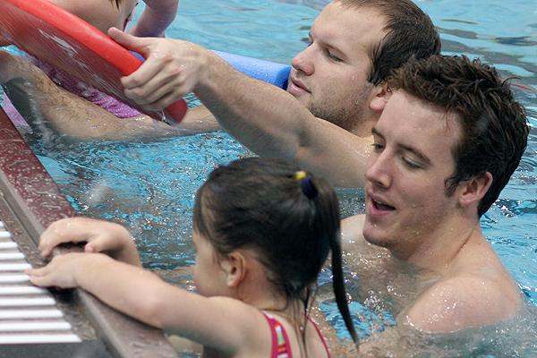 a group of people in a pool