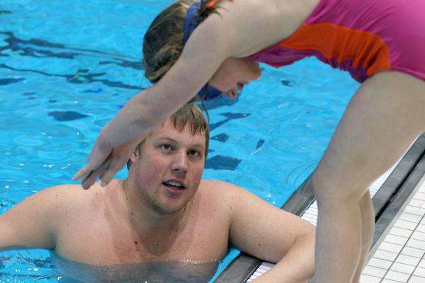 a man and woman in a pool