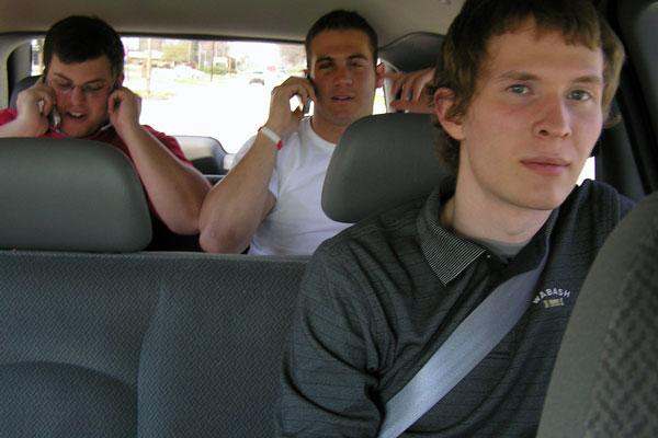 a group of men in a car