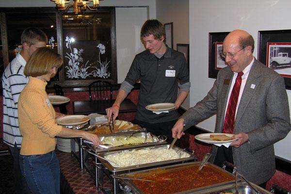 a group of people serving food