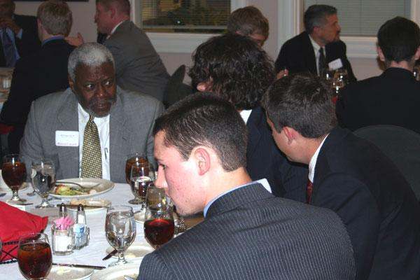 a group of people sitting at a table