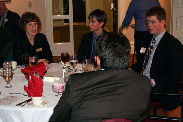 a group of people sitting around a table