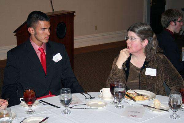 a man and woman sitting at a table