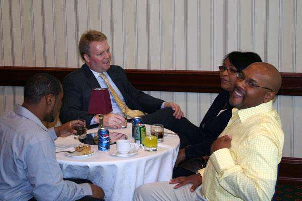 a group of people sitting around a table