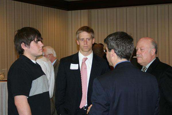 a group of men standing in a room