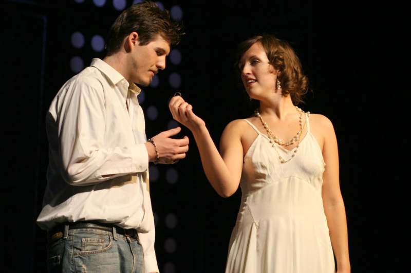 a man and woman on stage