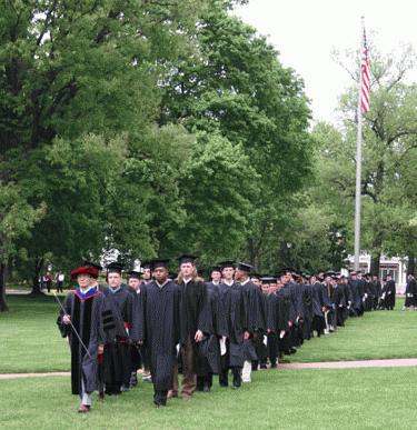 a group of graduates walking in a line