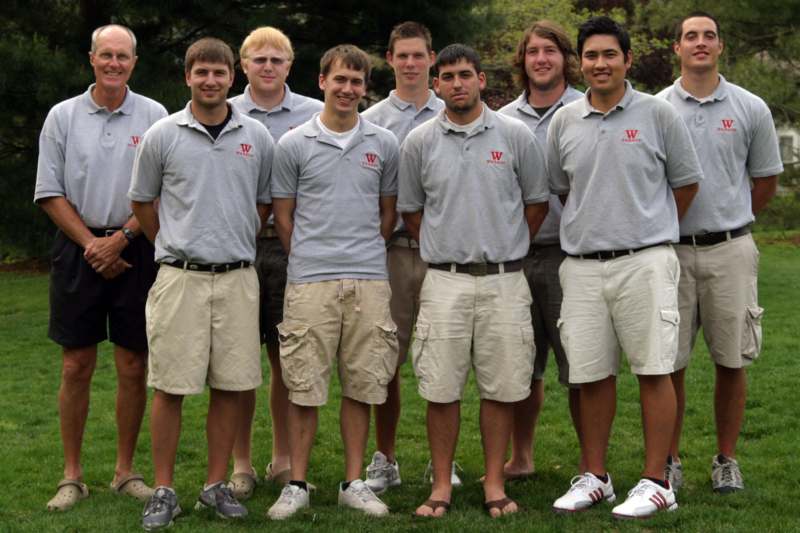 a group of men in grey polo shirts