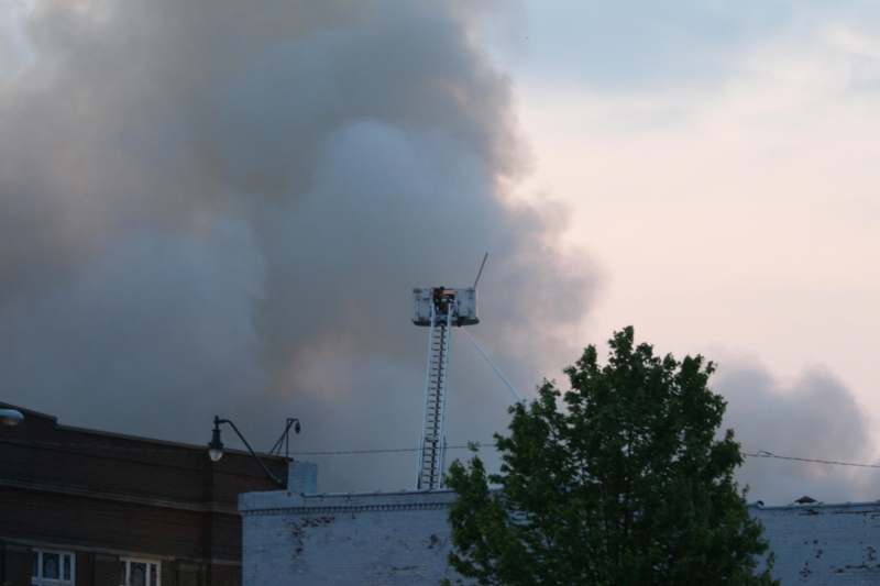 a firefighter on a ladder on a building