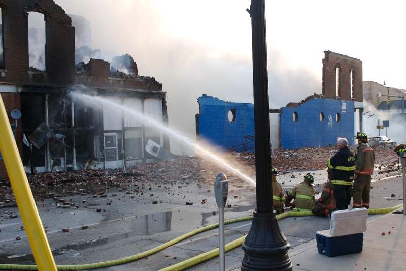 firemen spraying water on a building
