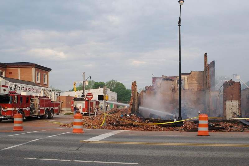 fire trucks and a building that has been destroyed