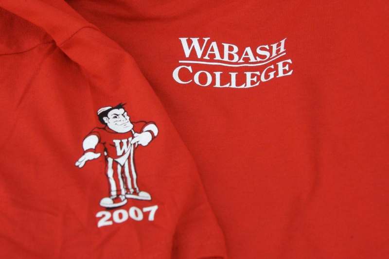 a red shirt with a mascot on it