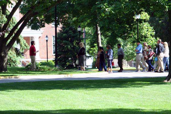 a group of people standing in a park