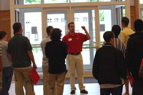 a man standing in front of a group of people