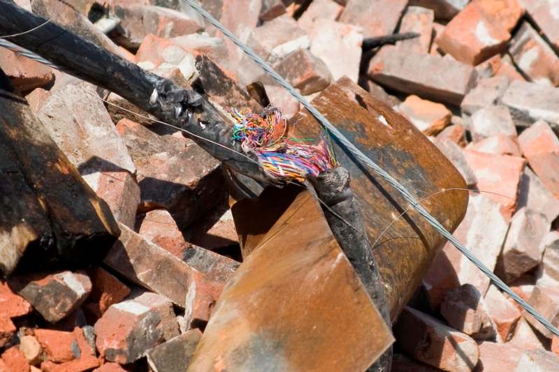 a broken wire on a pile of bricks