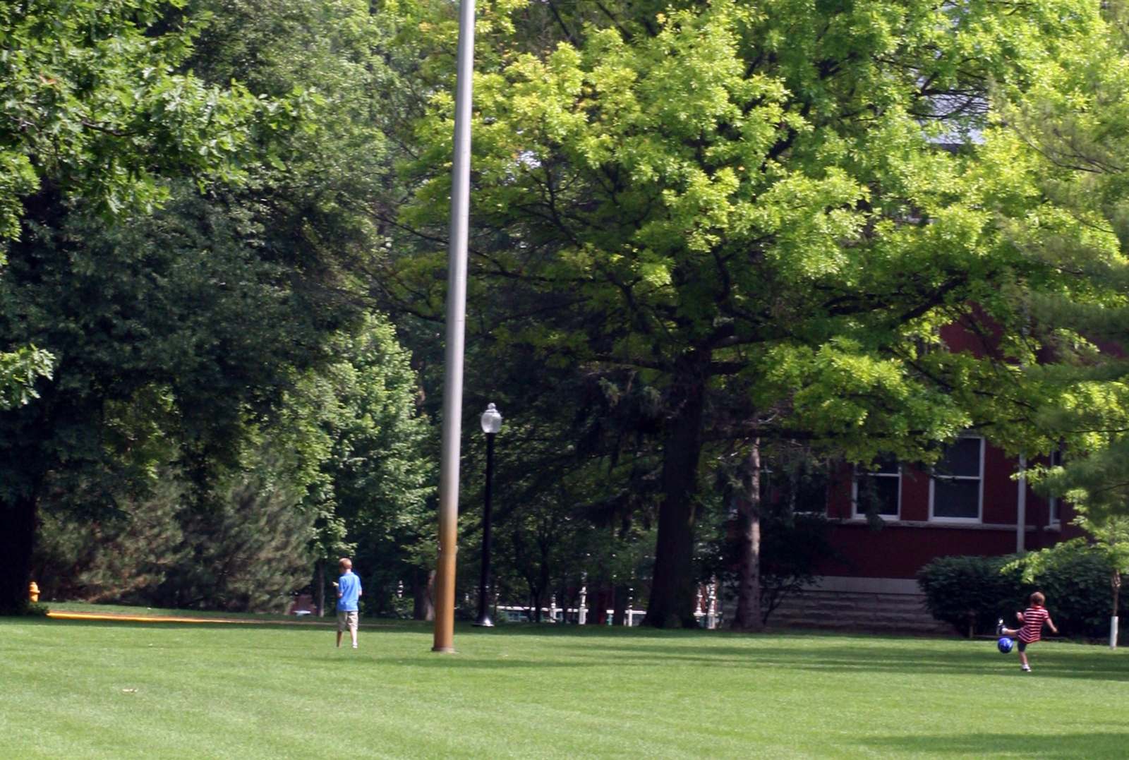 a boy standing in a park