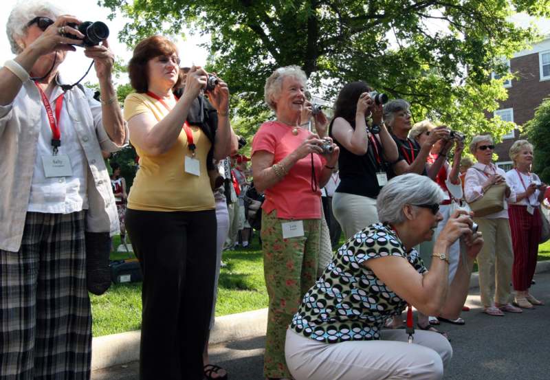 a group of people taking pictures