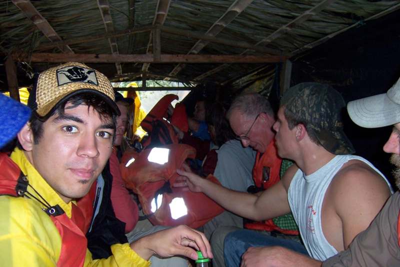 a group of people sitting in a shelter