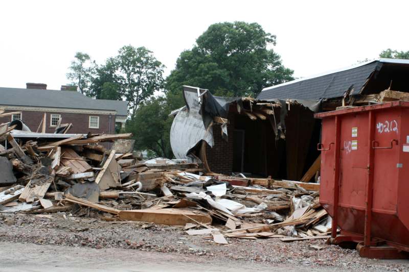 a pile of debris next to a building