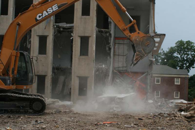 a construction vehicle digging a hole in the ground