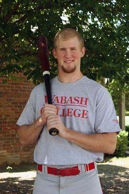 a man holding a baseball bat