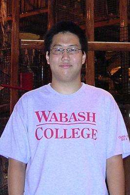 a man wearing glasses and a white shirt