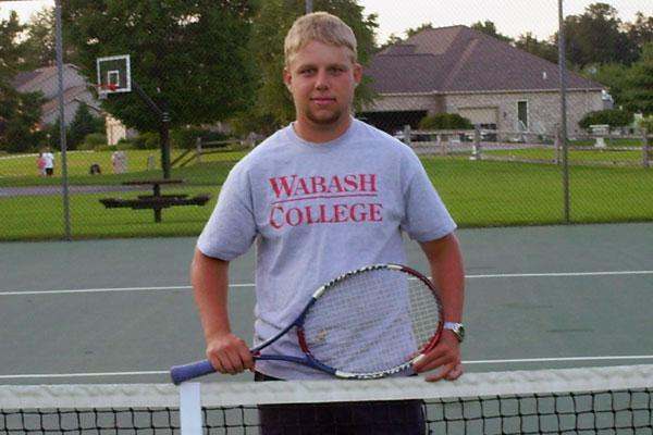 a man holding a tennis racket