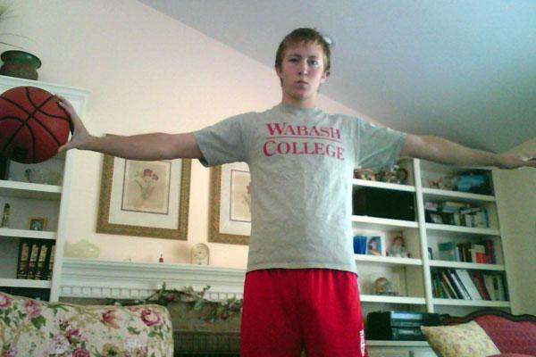 a boy with his arms out