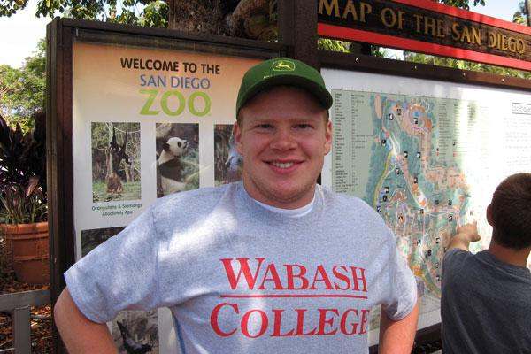a man standing in front of a map