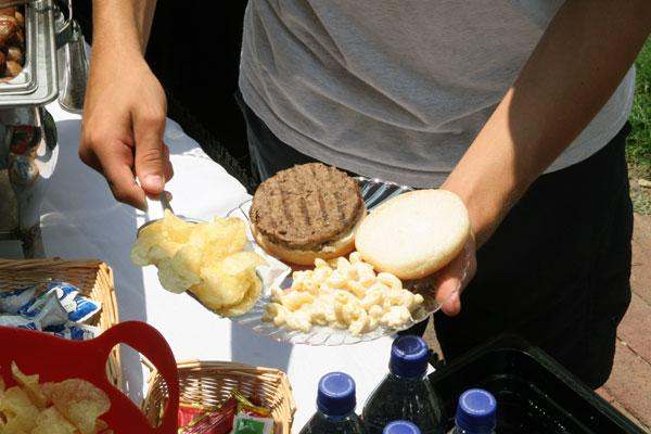 a man holding a plate of food
