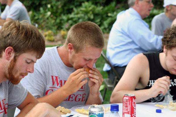 a group of people eating at a table