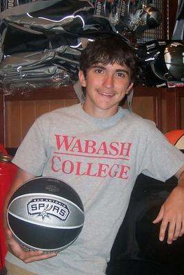 a young man holding a basketball