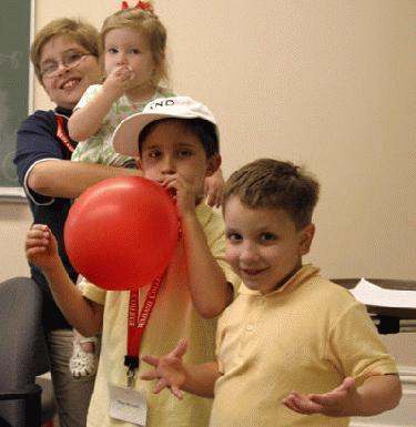 a group of children playing with a balloon