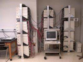 a computer on a cart with wires
