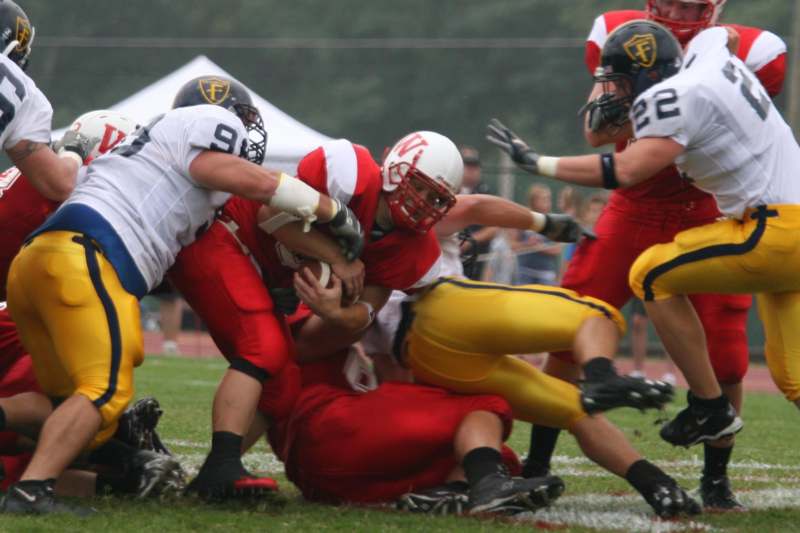 a group of football players in action
