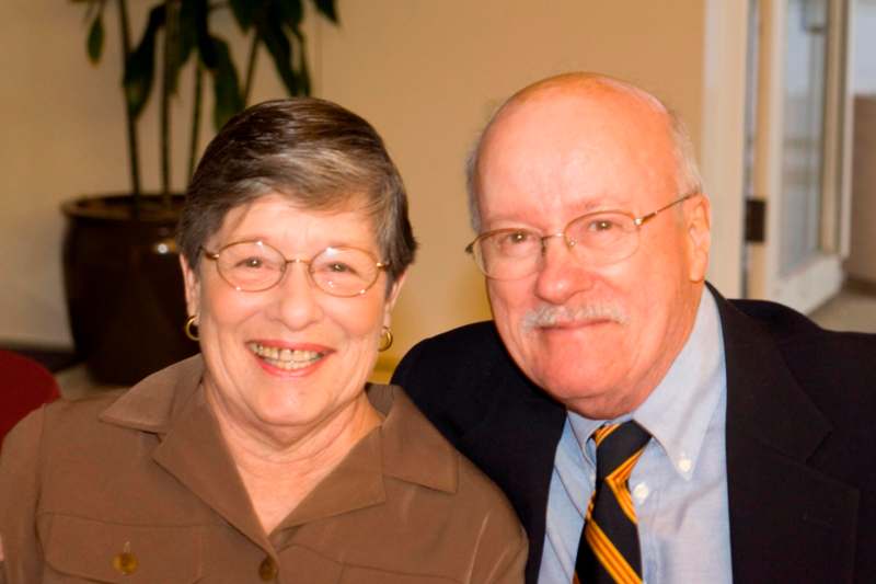 a man and woman smiling for a picture