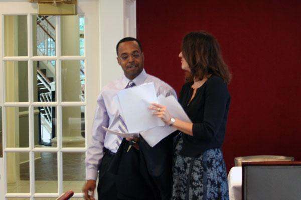 a man and woman standing next to each other