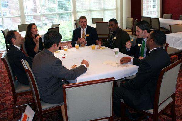 a group of people sitting around a table