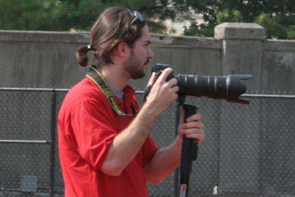 a man holding a large camera