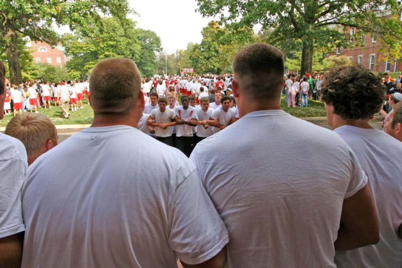 a group of men in white shirts