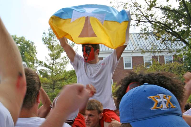 a man holding a flag over his head