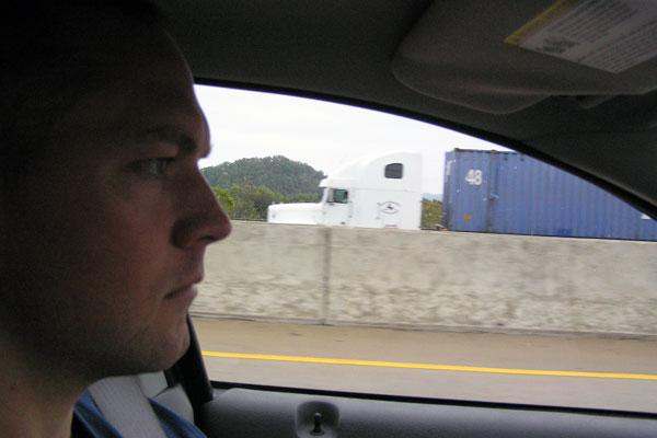a man in a car looking out the window