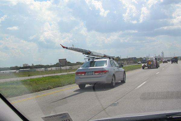a car with a boat on top of it